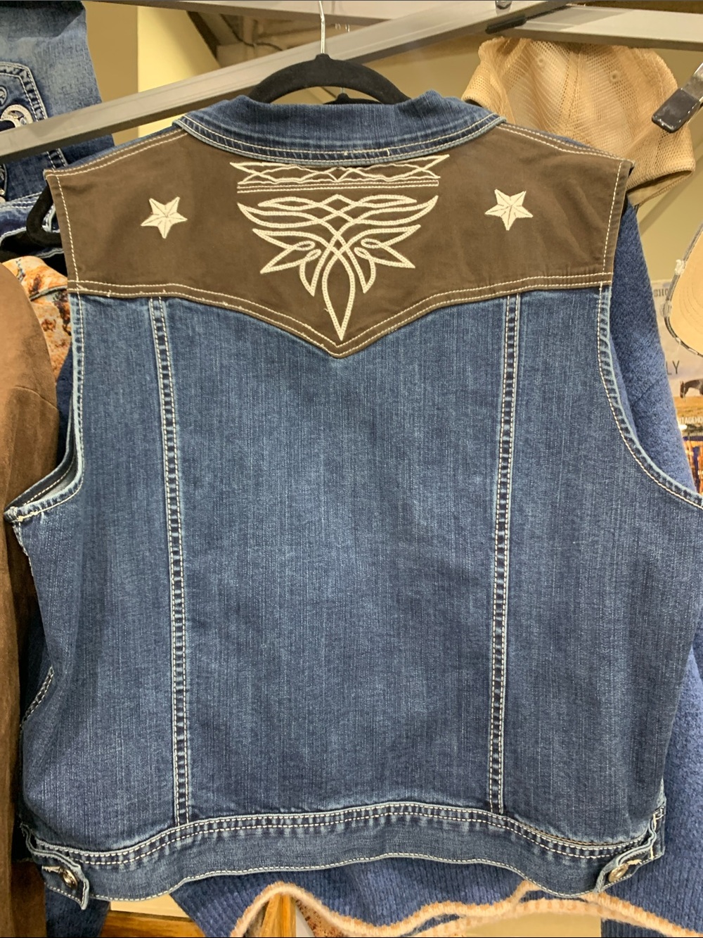 Grace in La denim vest with brown detail